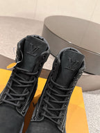 Black suede lace-up boots with embossed Louis Vuitton logos on side panels