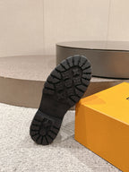 Black rubber outsole for ankle boot with deep tread pattern