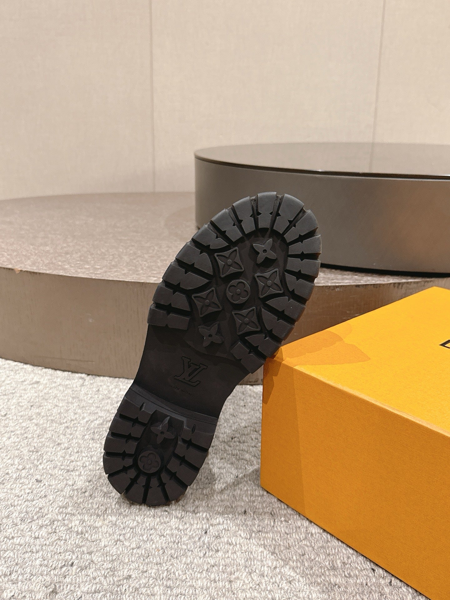 Black rubber outsole for ankle boot with deep tread pattern