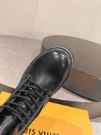 Louis Vuitton unisex black leather lace-up boot, close-up toe and laces on platform sole