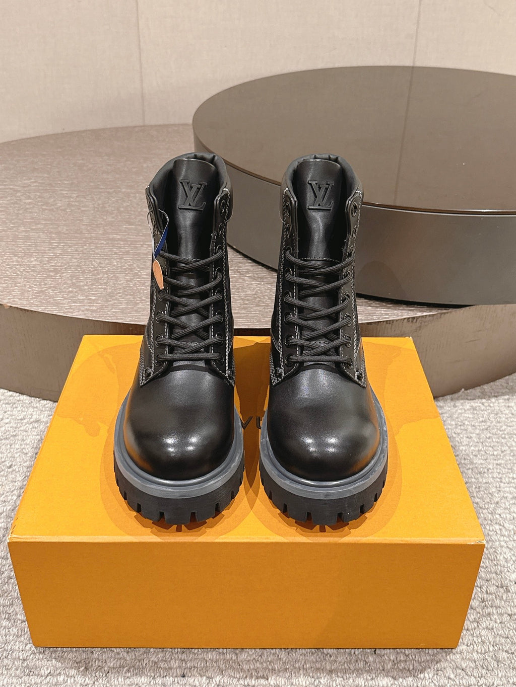 Louis Vuitton unisex black lace-up ankle boots, rear view on chunky rubber sole