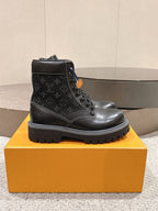 Louis Vuitton unisex lace-up ankle boots in black monogram leather, chunky tread sole
