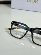 Dior eyeglasses with tortoise-pattern frame and clear lenses, angled view
