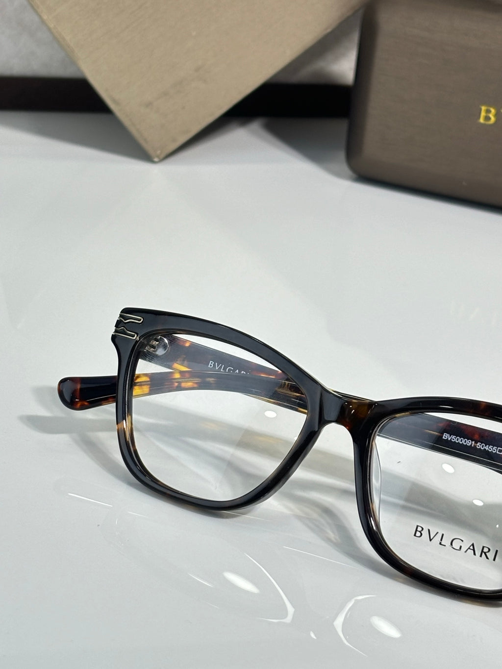 Bvlgari eyeglasses with tortoiseshell round-rect frames and clear lenses