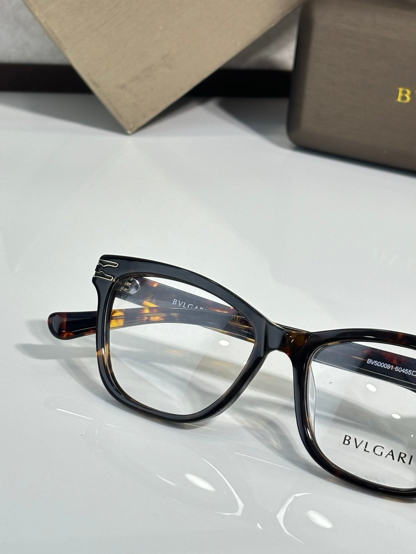 Bvlgari eyeglasses with tortoiseshell round-rect frames and clear lenses