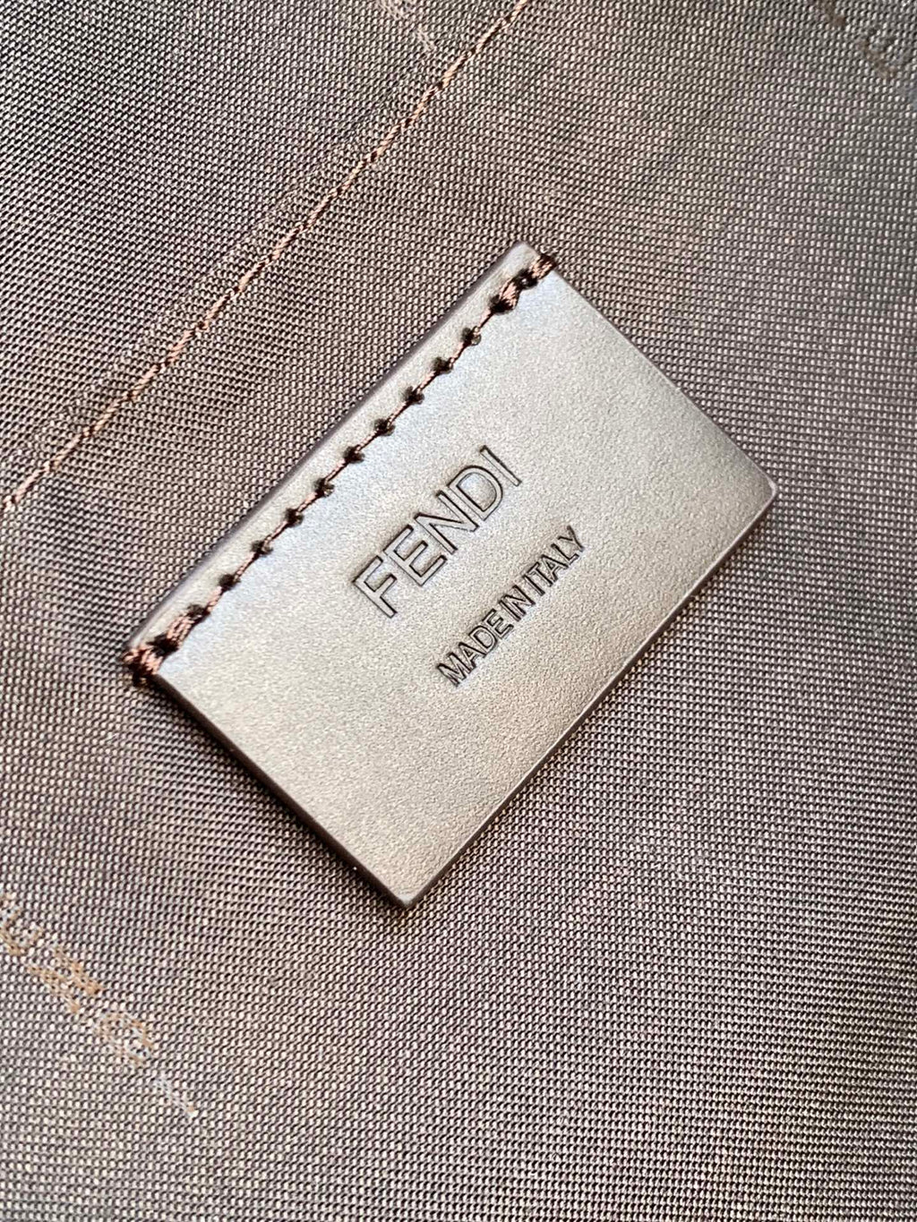Fendi Made in Italy tag on dark brown pebbled leather bag