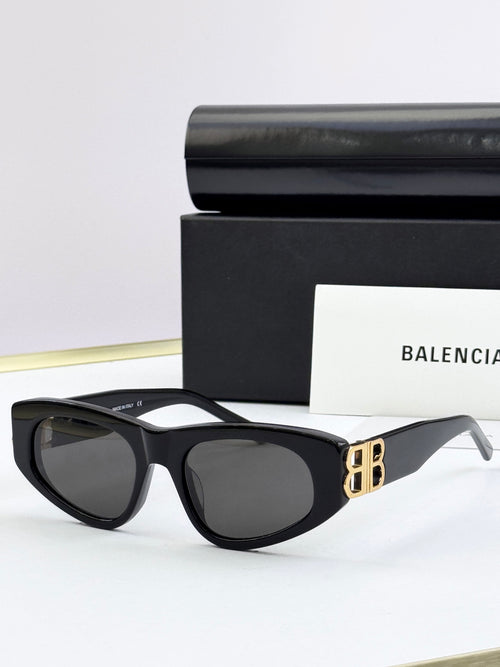 Black cat-eye sunglasses with dark lenses and gold B logo on temples