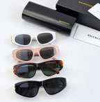 Assorted sunglasses: white, blush pink, tortoiseshell, and black pairs