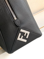 Black leather bag corner with metal F logo plate and silver zipper hardware