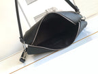 Black leather crossbody bag with zip-top closure and open interior view