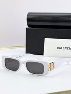 Balenciaga sunglasses with white frames, gold B logo temples, dark lenses