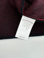 Black long-sleeve top label with care and made in USA text
