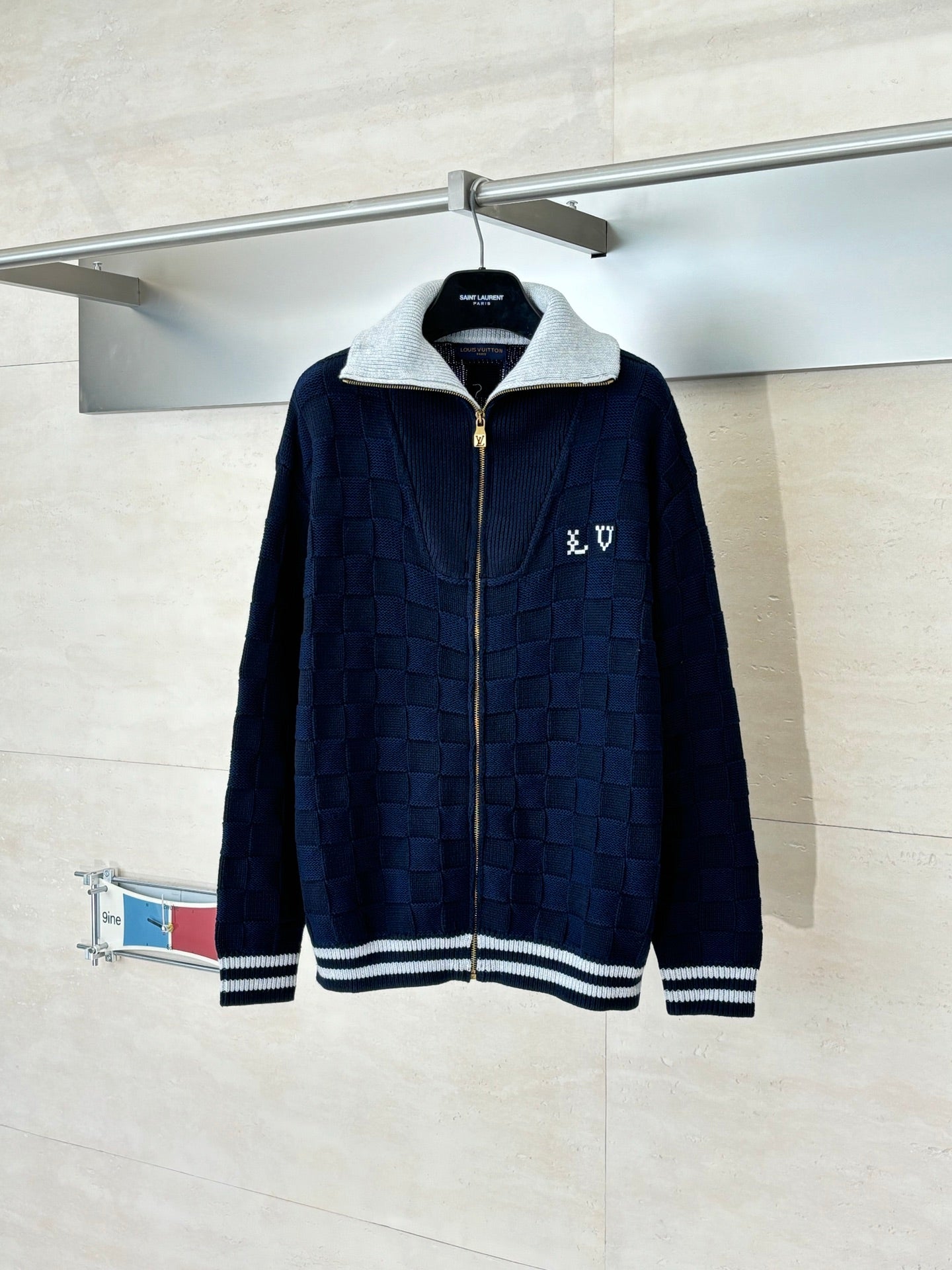 Louis Vuitton navy knit zip jacket with light gray stand collar and striped cuffs