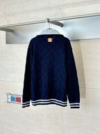 Louis Vuitton navy knit zip jacket, back view with striped hem and gold zipper pull