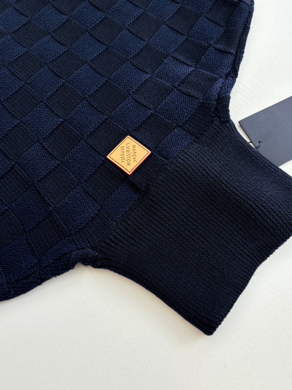 Louis Vuitton navy knit hood with ribbed collar and gold brand label patch