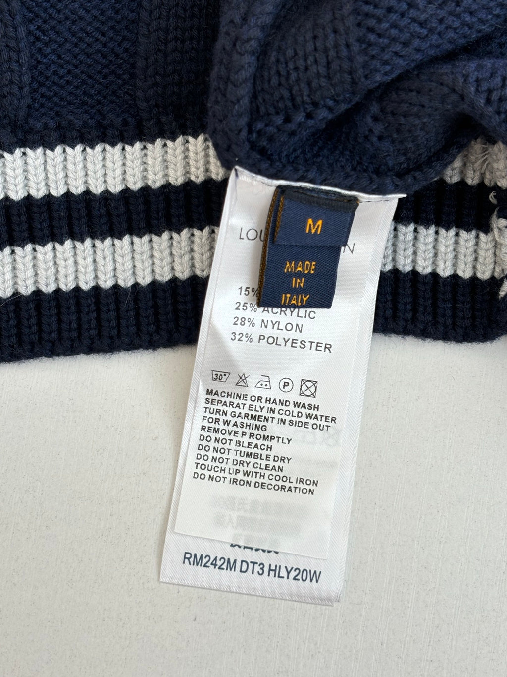 Striped long knit sweater with Louis Vuitton size tag and care label