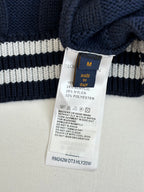 Striped long knit sweater with Louis Vuitton size tag and care label