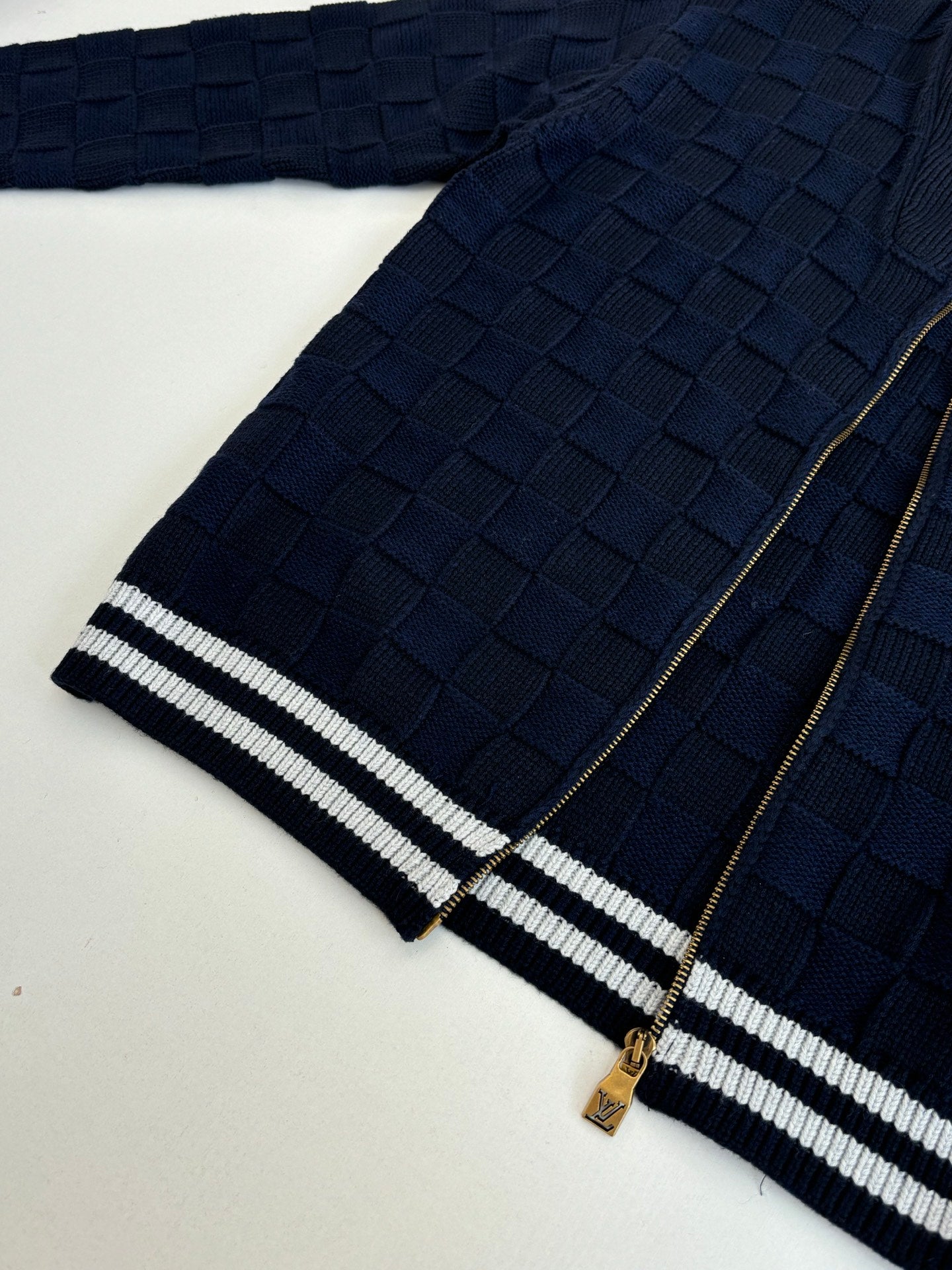 Louis Vuitton navy knit jacket hem with striped banding and gold zipper