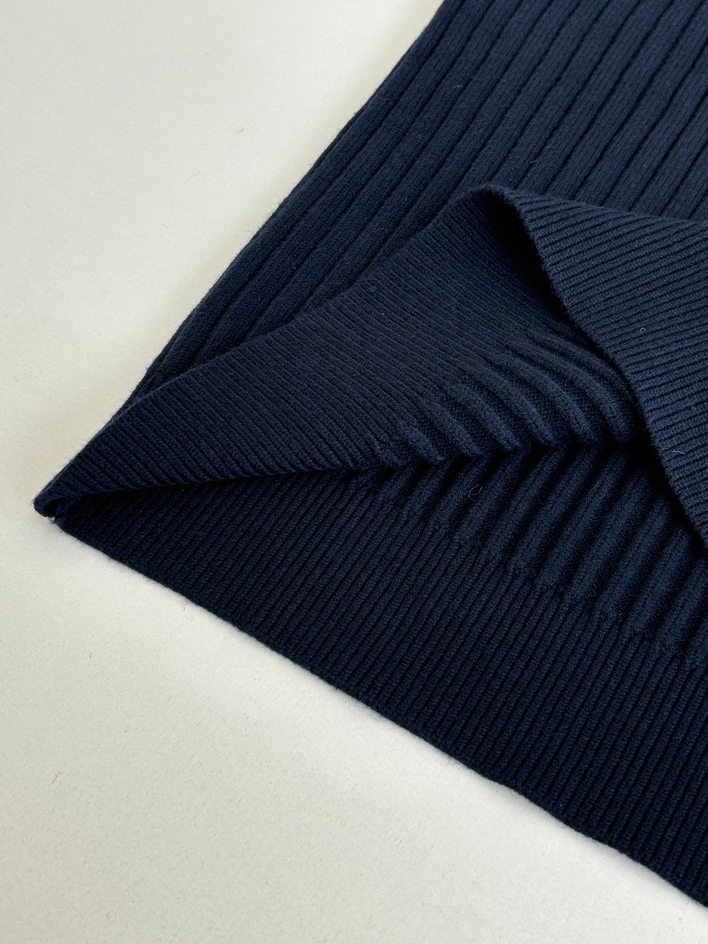 Navy ribbed knit sleeve cuff detail