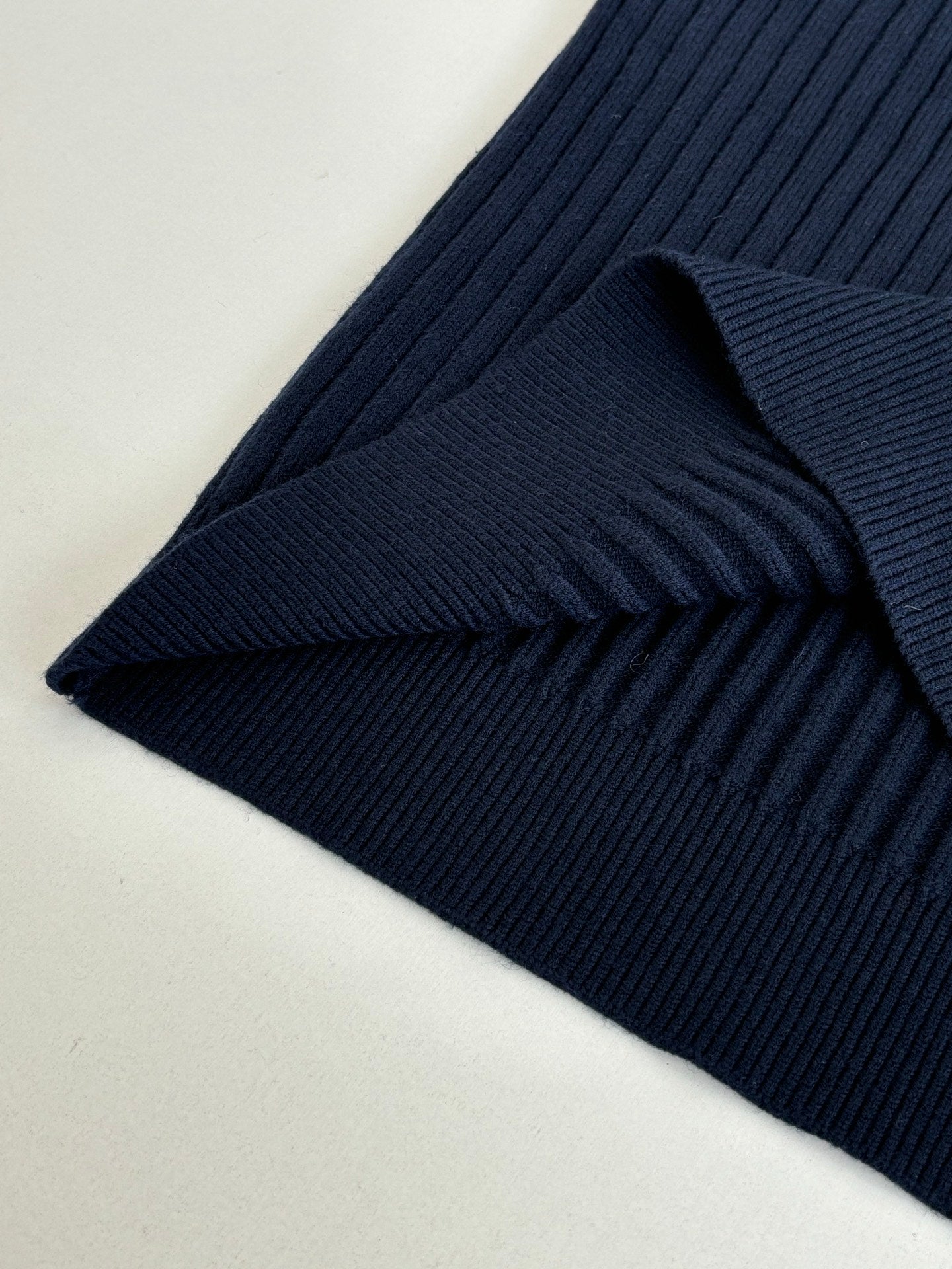 Navy ribbed knit sleeve cuff detail