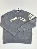 Grey knit crewneck sweater with MONCLER lettering and ribbed hem