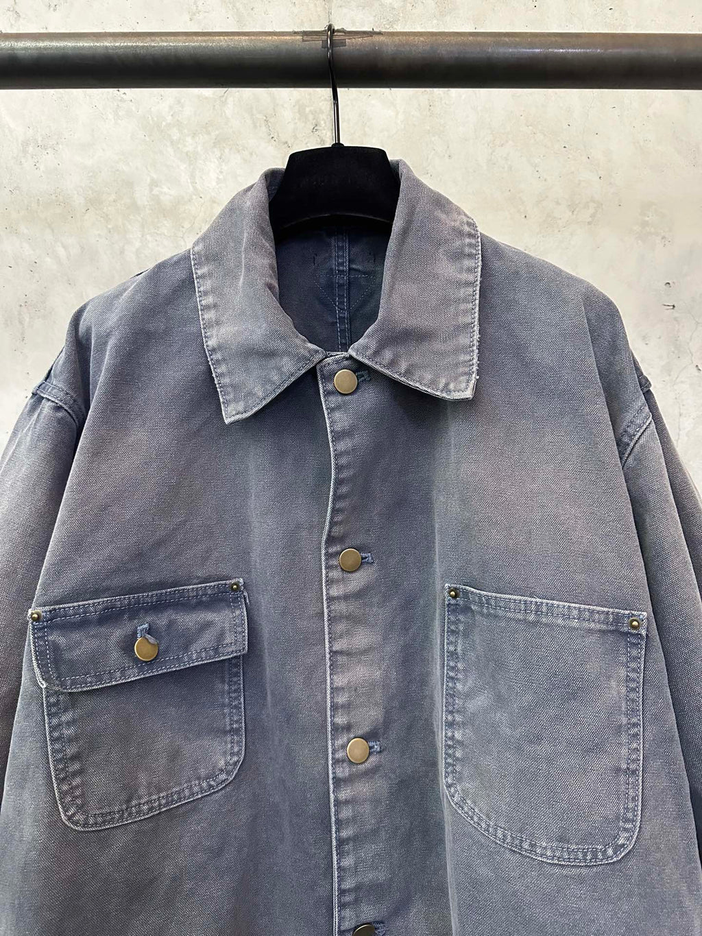 Long denim jacket in dark blue-gray with point collar, gold-tone buttons, chest pockets