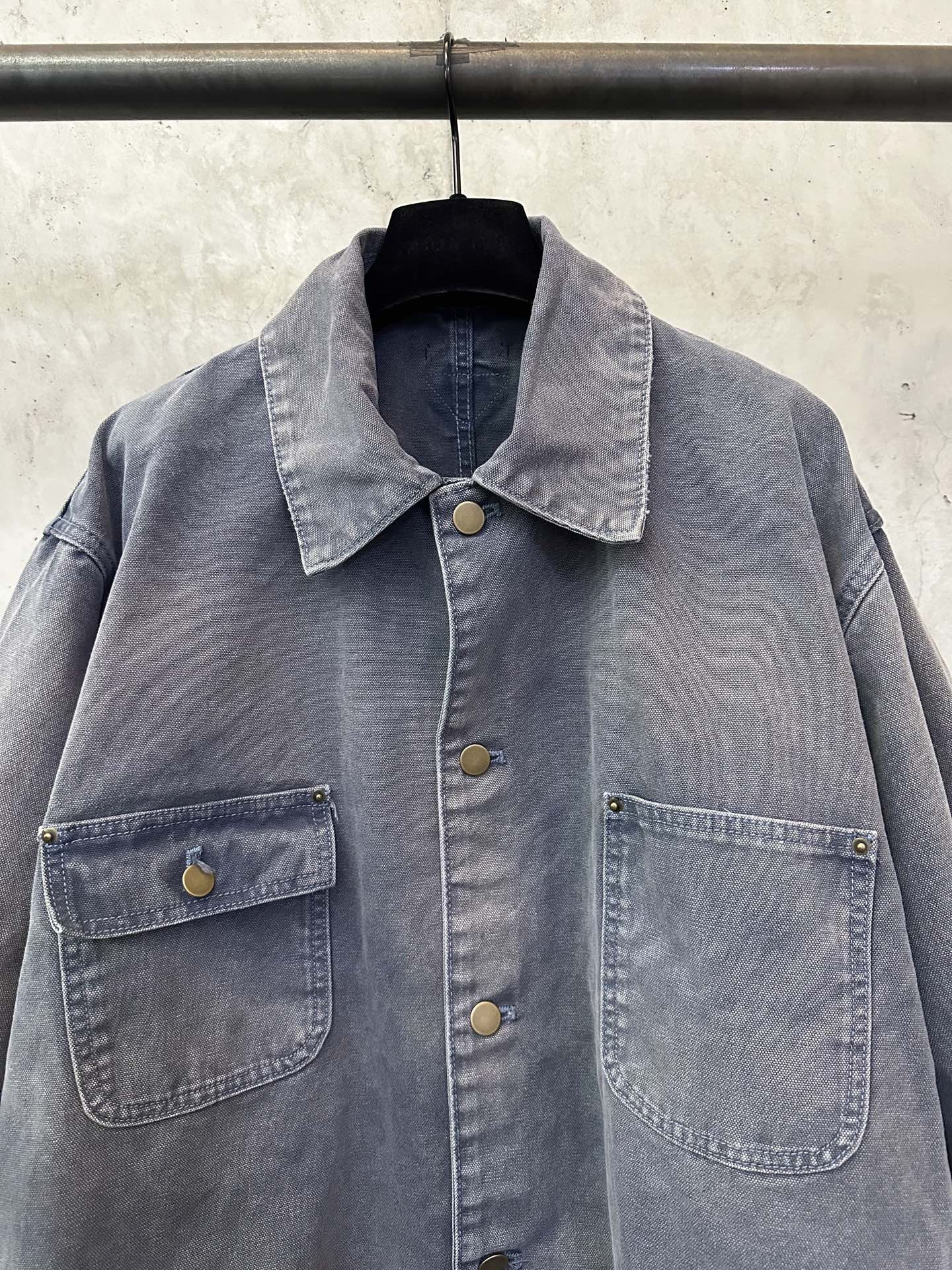 Long denim jacket in dark blue-gray with point collar, gold-tone buttons, chest pockets