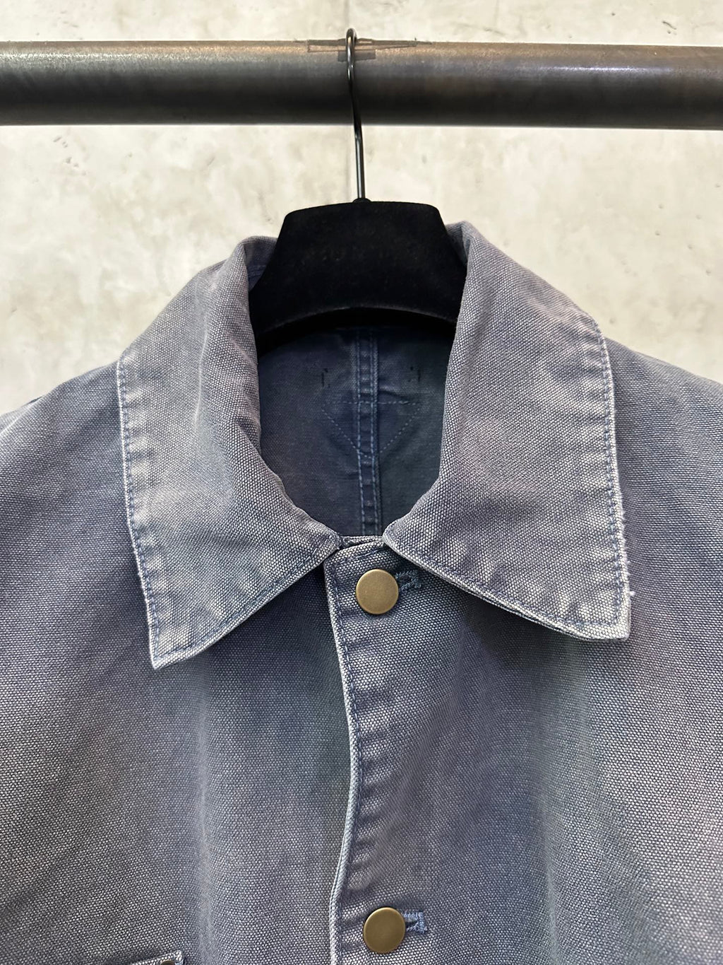 Collared long denim jacket in dark blue-gray with gold-tone buttons at front