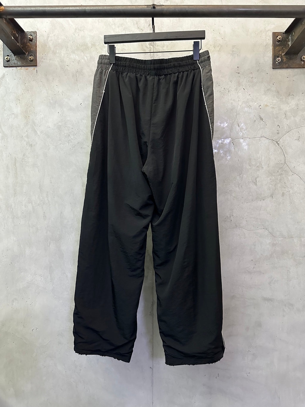 Black Balenciaga pants with gathered waist and oversized wide-leg silhouette