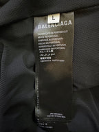 Balenciaga pants care label showing size L and Made in Portugal