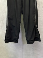 Black Balenciaga pants with wide cropped legs and stitched hem edges