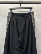 Black Balenciaga pants with gathered waist and side seam detailing