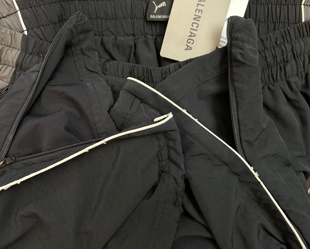 Black Balenciaga pants with zip opening and smooth interior drawcord detail