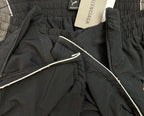 Black Balenciaga pants with zip opening and smooth interior drawcord detail