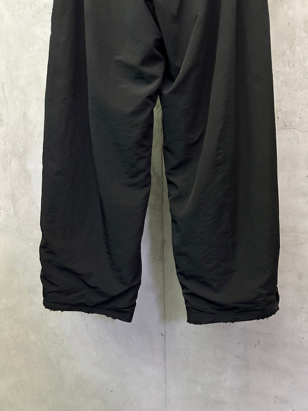 Black Balenciaga pants with loose wide-leg fit and elastic cuffs