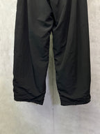 Black Balenciaga pants with loose wide-leg fit and elastic cuffs