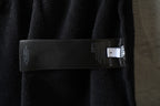 Balenciaga dark shorts with interior label strip near the side seam