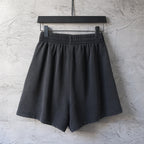 Balenciaga dark charcoal pants with elastic waistband and pleated front