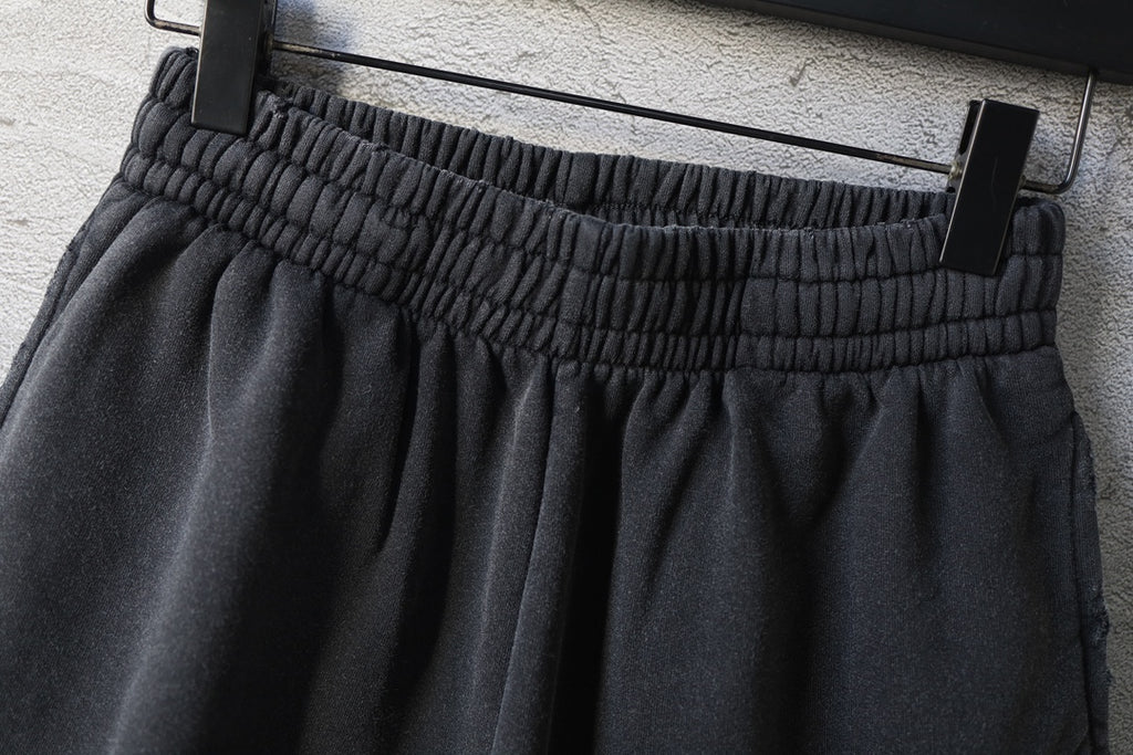 Balenciaga dark shorts with pleated front and elastic waistband