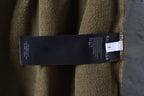 Olive shorts with Balenciaga brand label and inner care tag
