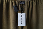Olive shorts with Balenciaga hang tag attached at the waist