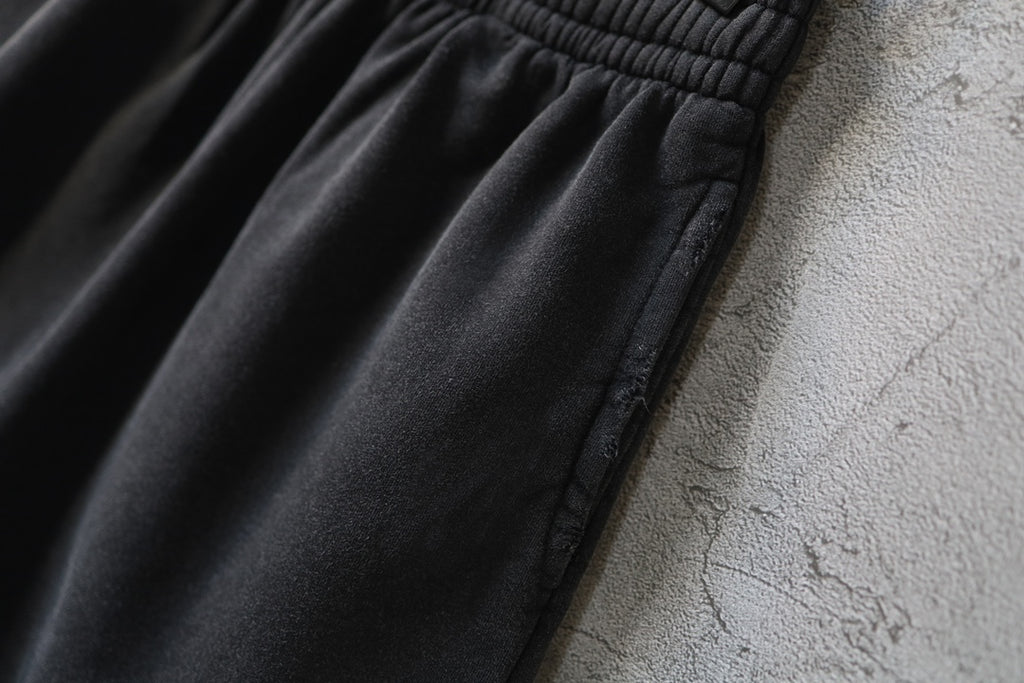 Balenciaga dark shorts with gathered waist and smooth fabric panels