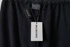 Black pants waistband with hang tag and Balenciaga logo patch