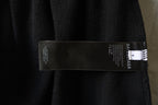 Inside care label on black pants waistband
