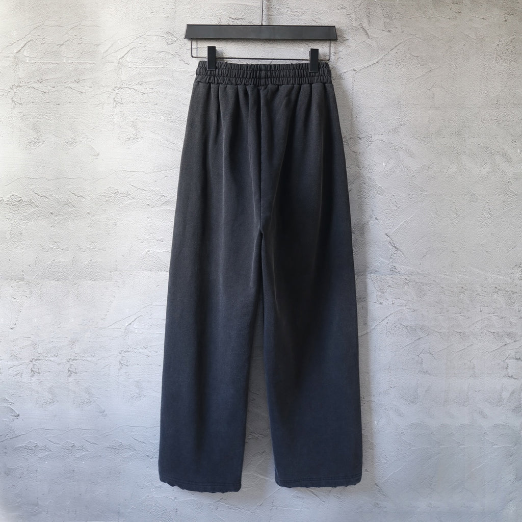 Black wide-leg pants with elastic waistband, no visible front logo