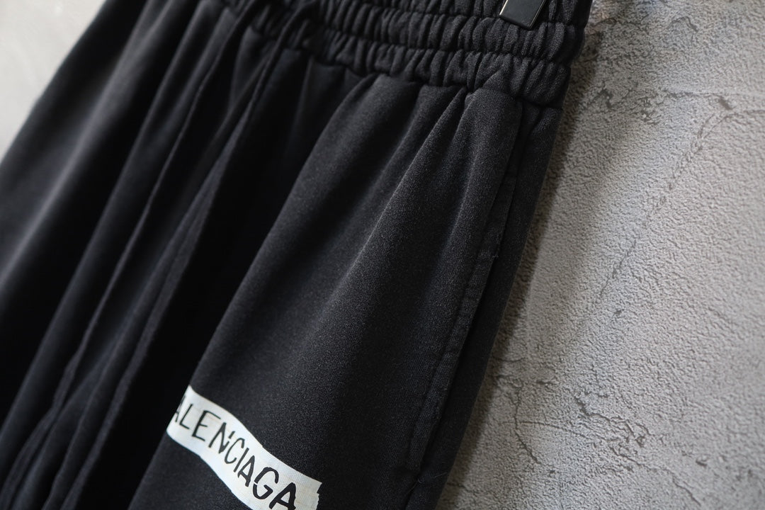 Black pants with gathered elastic waist and Balenciaga logo patch