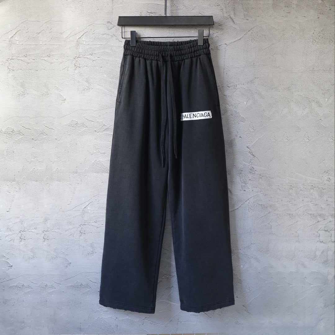 Balenciaga wide-leg pants with elastic waistband and black logo patch