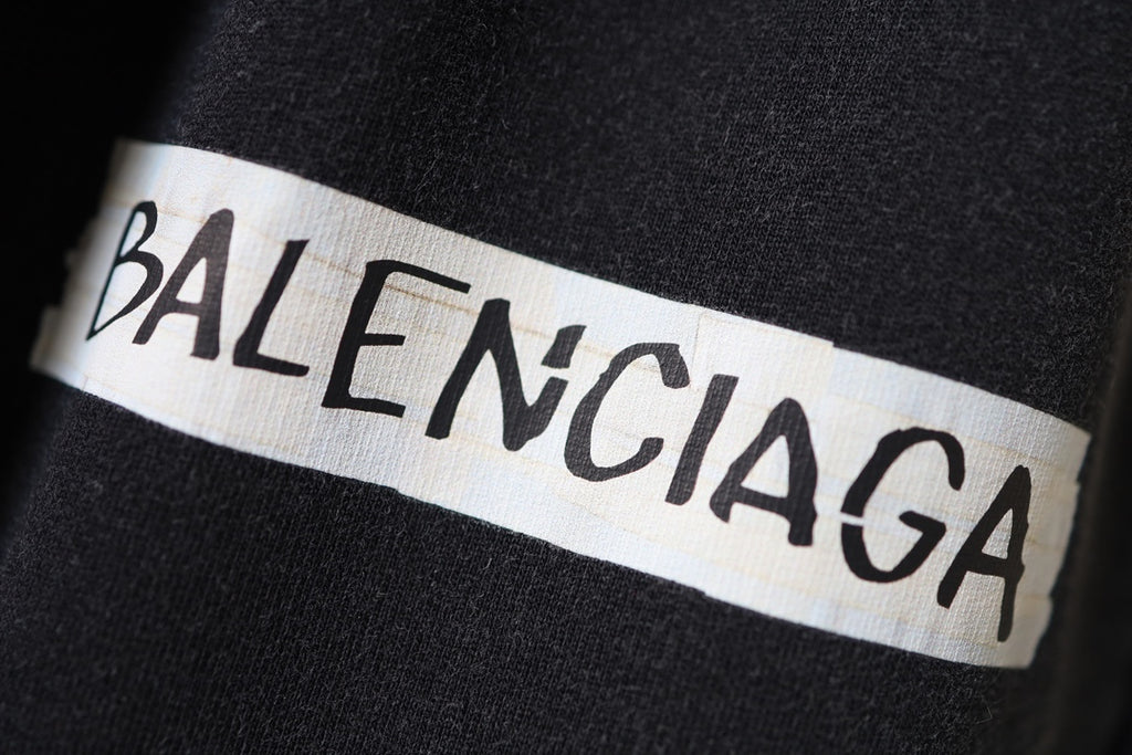 Balenciaga logo patch on dark fabric