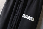 Balenciaga logo patch on black wide-leg pants