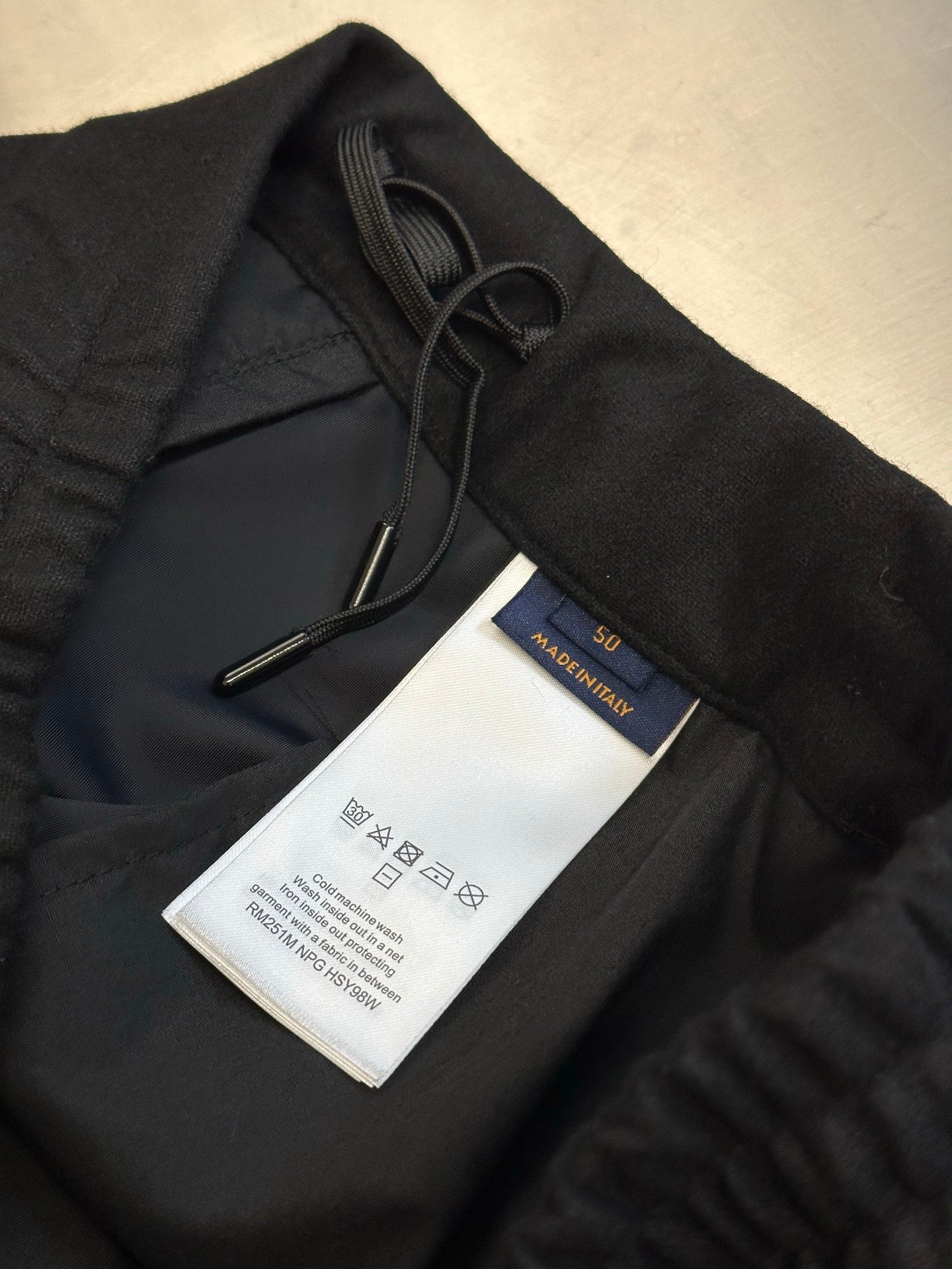 Louis Vuitton pants, black with interior drawcord and attached care label tag